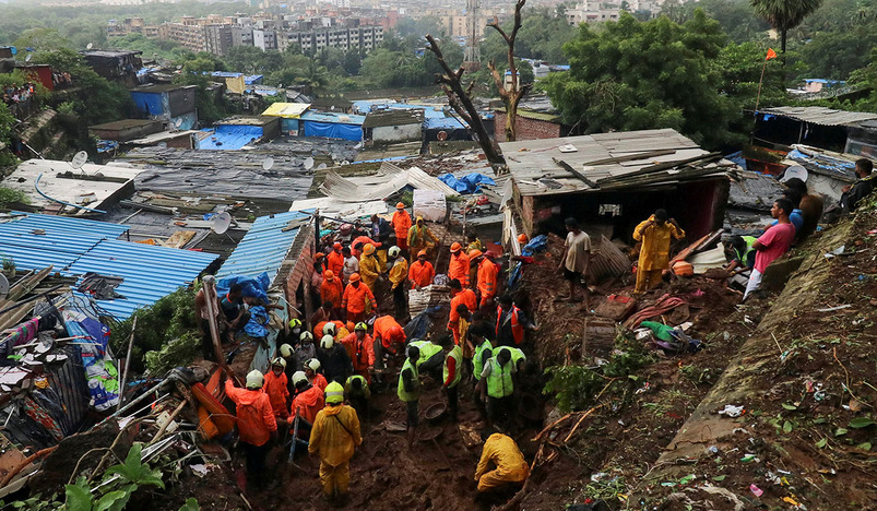 Heavy rains kill 18 in India dozens feared trapped in landslides